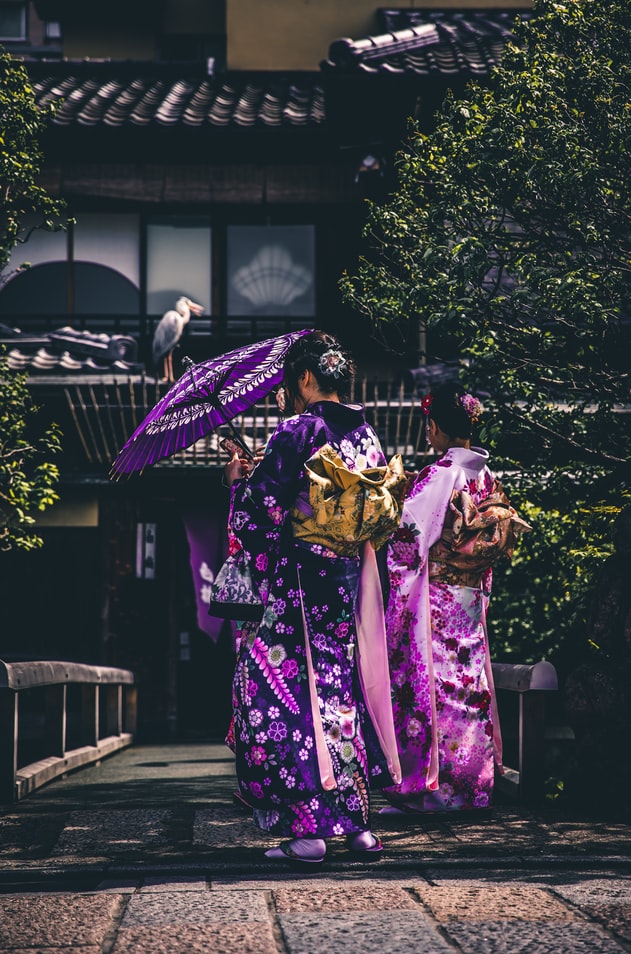 Japanese ladies wearing purple kimonos