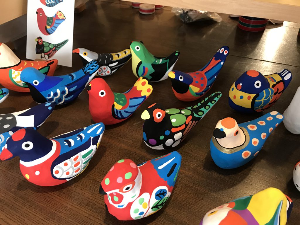 Colorful and very diverse bird-shaped toys
