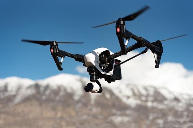 Drone flrying in front of a montain