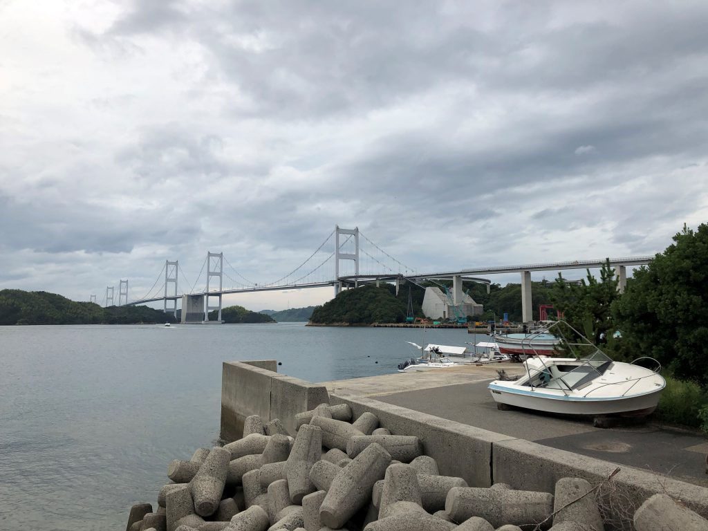 Long metallic bridge, the sea and boats