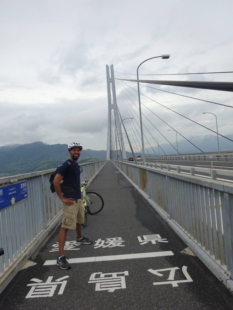 The author standing on a border line on a bridge