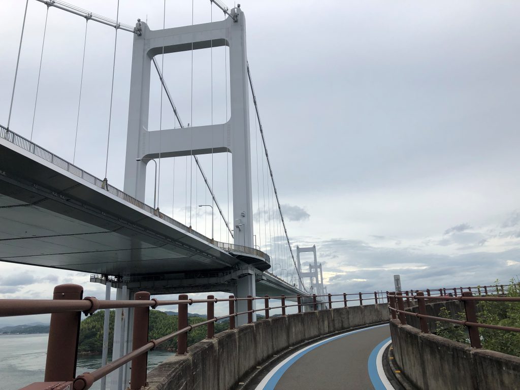 A metallic bridge viewed from an incline