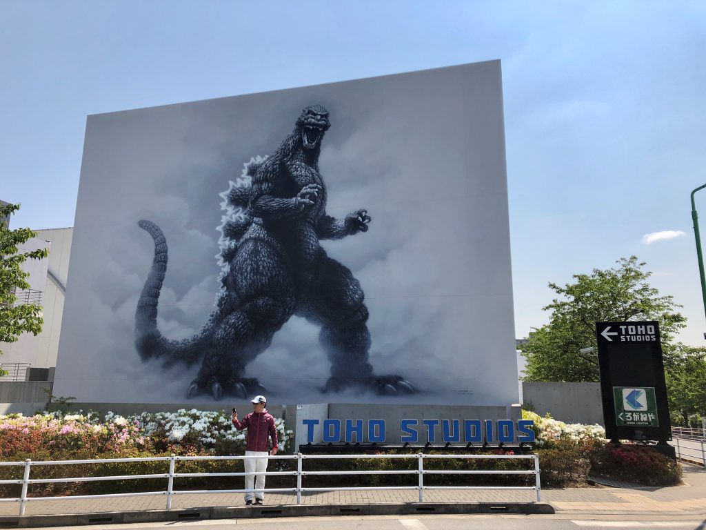 The entrance of Toho Studios marked by a huge Godzilla mural