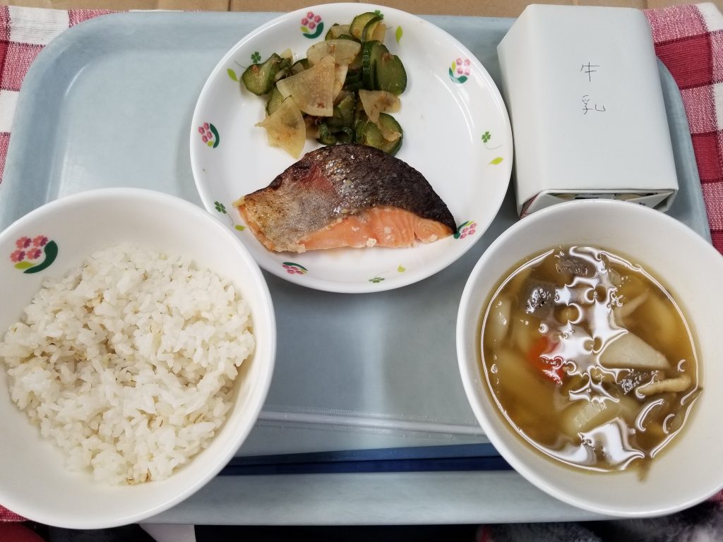 A meal made with rice, vegetables and a soup of mushrooms and vegetables