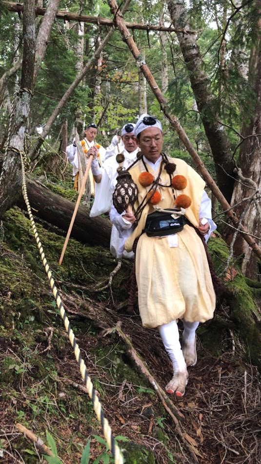 Shugenja walking in the forest, Mr. Tani in front