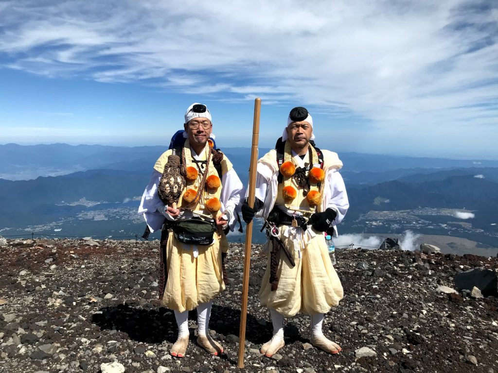 Two shugenja on top of Mount Fuji