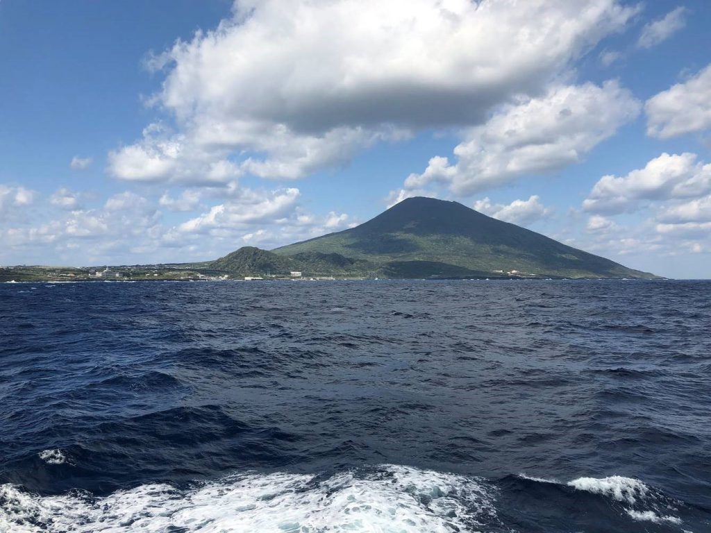 A mountain looking like a smaller version of Mount Fuji