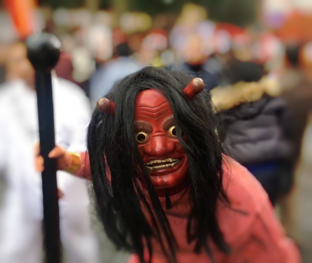 A Japanese demon fully covered in red