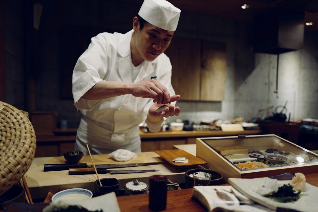 A Japanese sushi chef making sushi