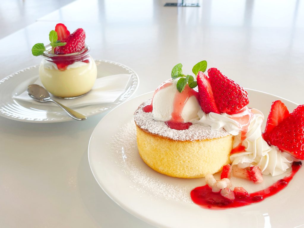 Two plates with strawberry desserts.