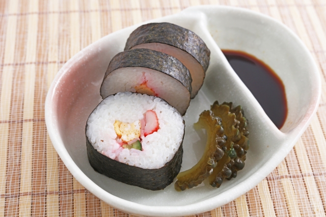 A big sushi roll in a plate
