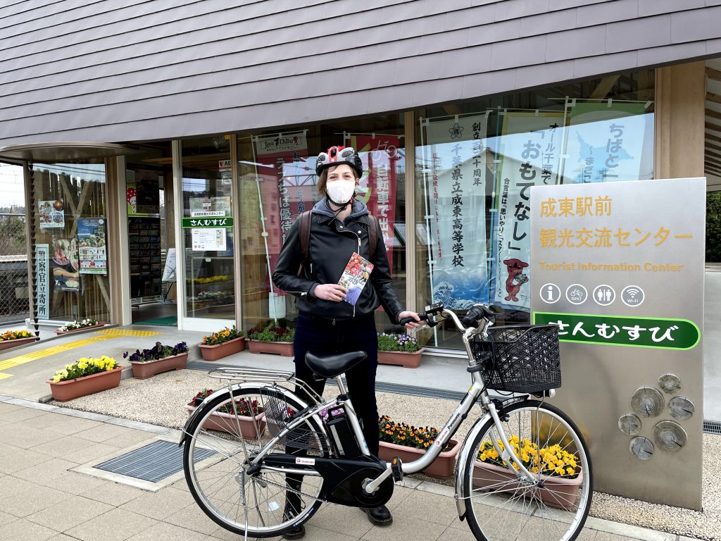 The author standing next to a bicycle