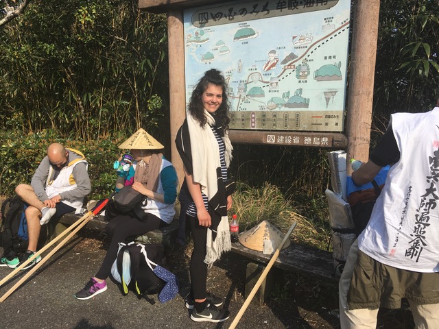 Western pilgrims are resting on the side of the road