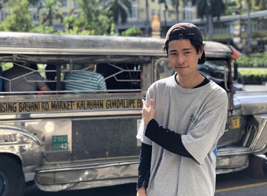 Fumiya in front of a Philippines bus