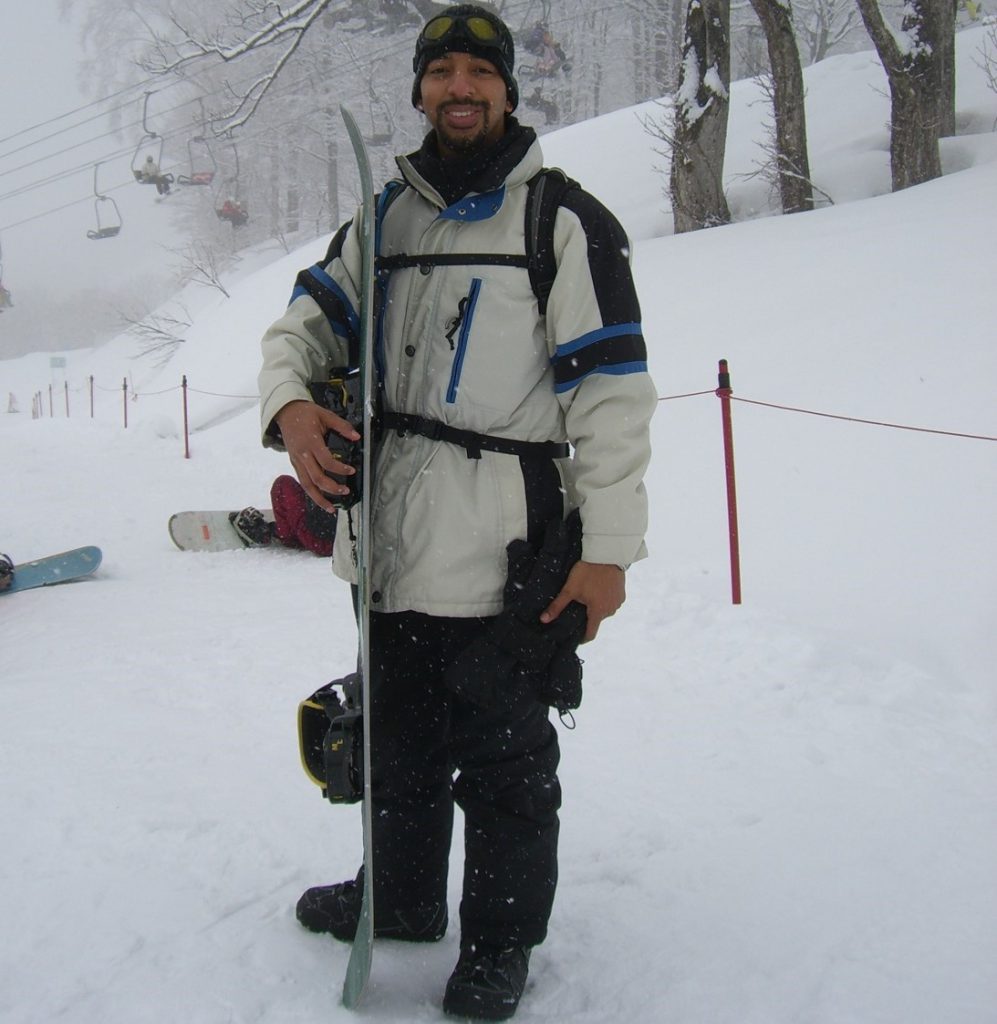 Anthony holding a snowboard