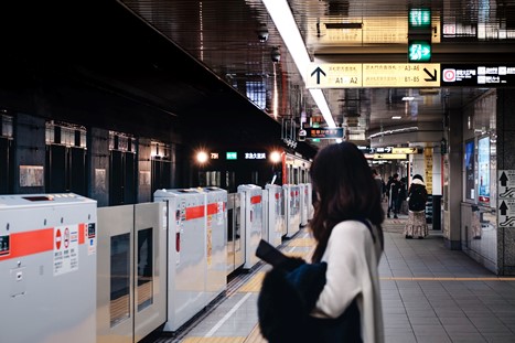 A metro train is entering a station