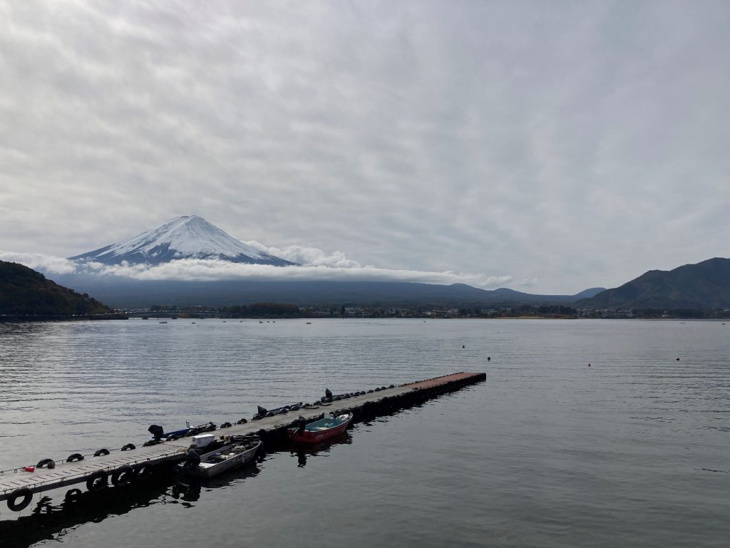 Snow-topped Mount Fuji can be seen in the back of Lake Kawaguchi