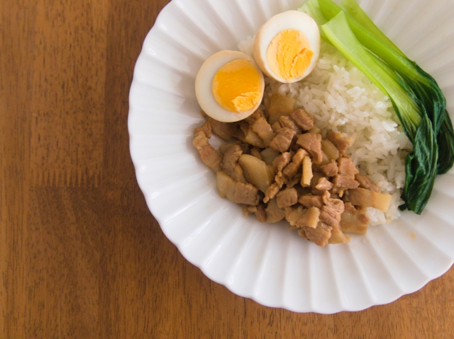 Lo bah png: a dish with marinated pork, rice, eggs and vegetables