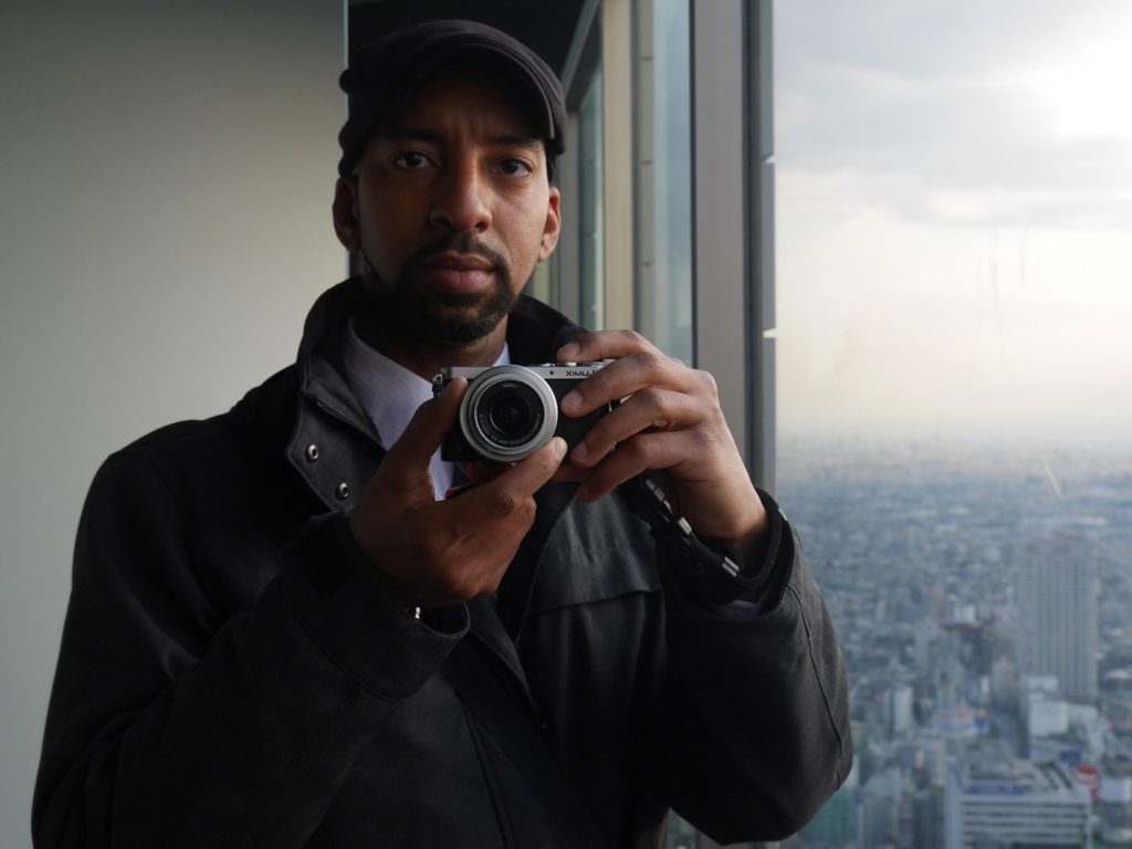 Anthony Griffin holding a camera