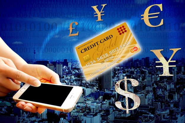 A picture shows a city on a blue background. In front, symbols for different currencies float in the air around a golden credit card. On the left, hands are holding a smartphone.