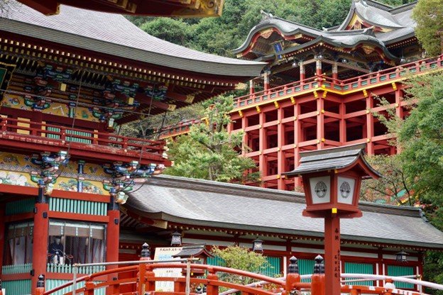 An elevated red wooden building 