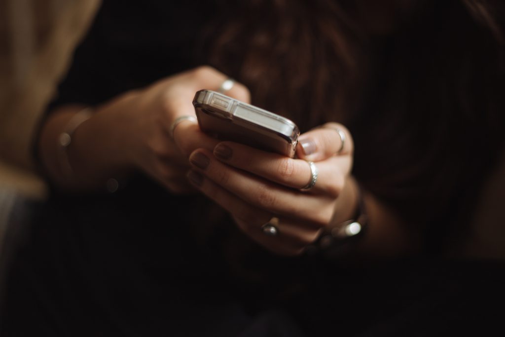 Someone's hands holding a smartphone.